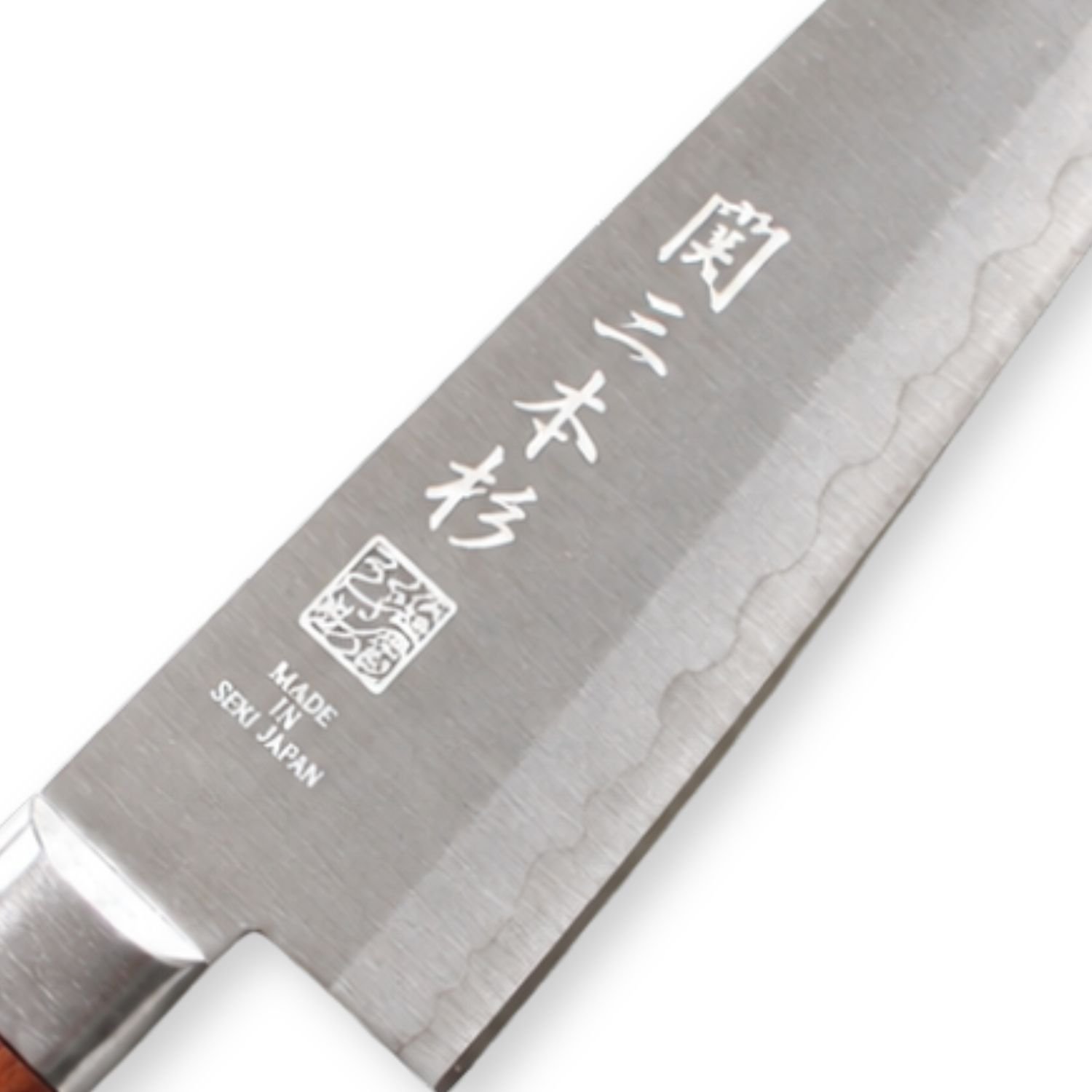 A kitchen knife focusing on its logo on the blade